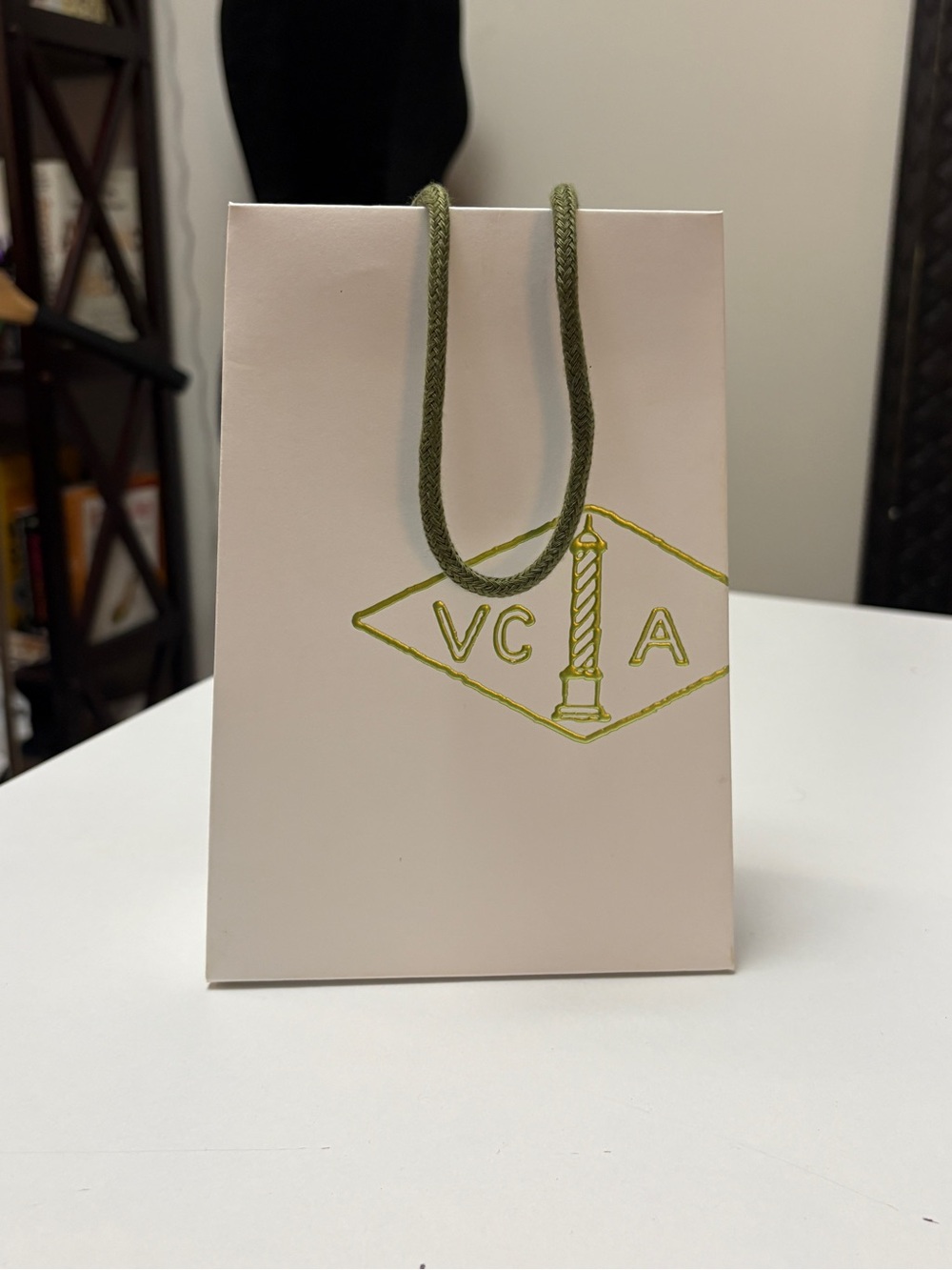 Van Cleef & Arpels white Gift Bag with Gold Logo. 5.5”x2.5”x7.75”